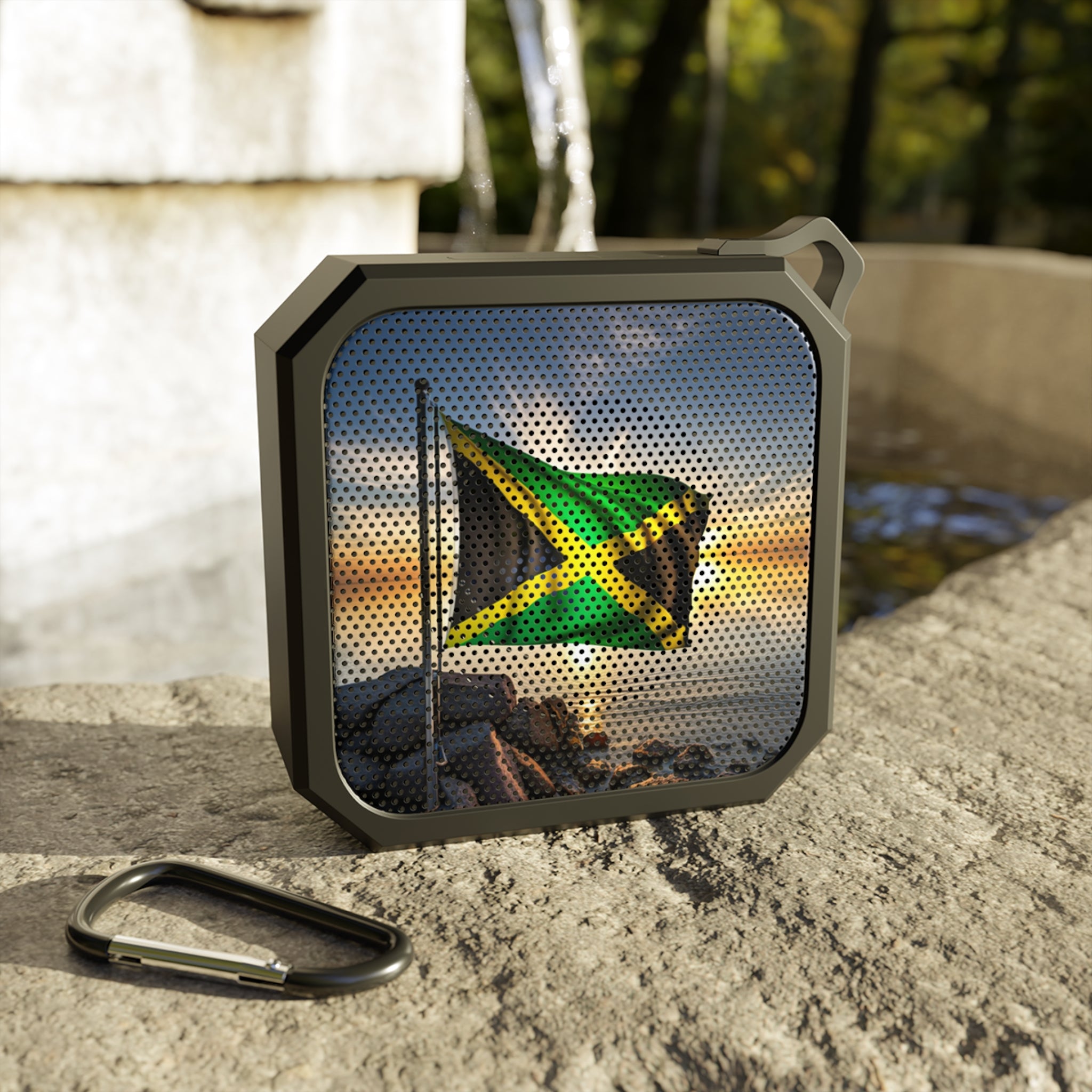 Blackwater Outdoor Bluetooth Speaker with a Jamaican design. Affordable, portable, and perfect for taking your music anywhere.  Jam to Reggae Anywhere: Blackwater Outdoor Bluetooth Speaker. Rugged, Waterproof, Crystal Clear Sound.