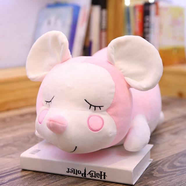 Mouse doll lying on the mouse pillow