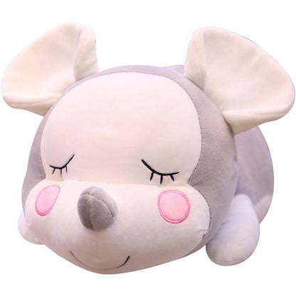 Mouse doll lying on the mouse pillow