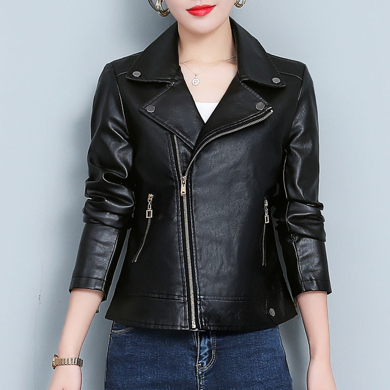 Black leather jacket worn by a person on a light gray background