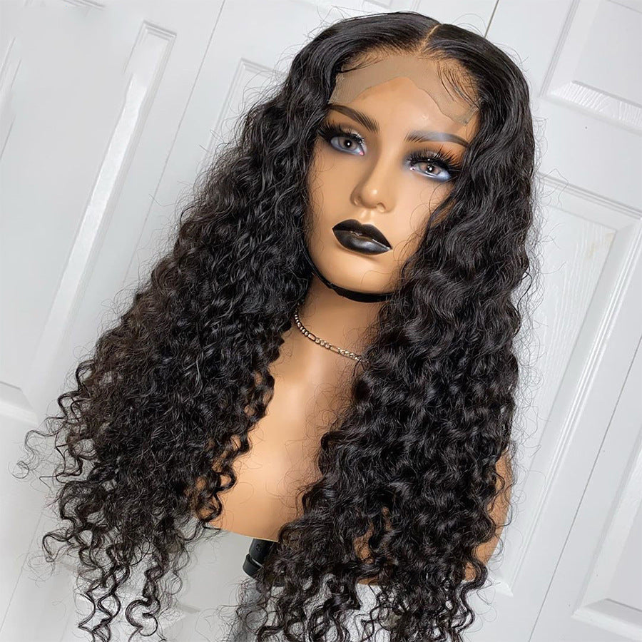 Mannequin head with long, wavy black hair against a white background